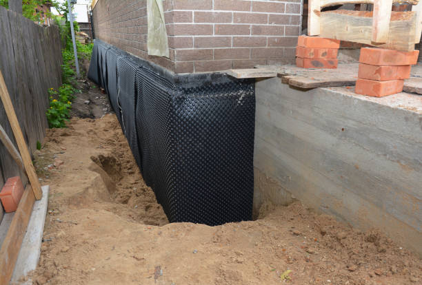 Happy homeowners after waterproofing job in Eaton